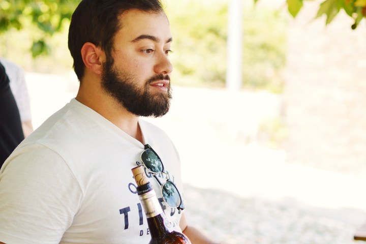 a man holding a glass of wine